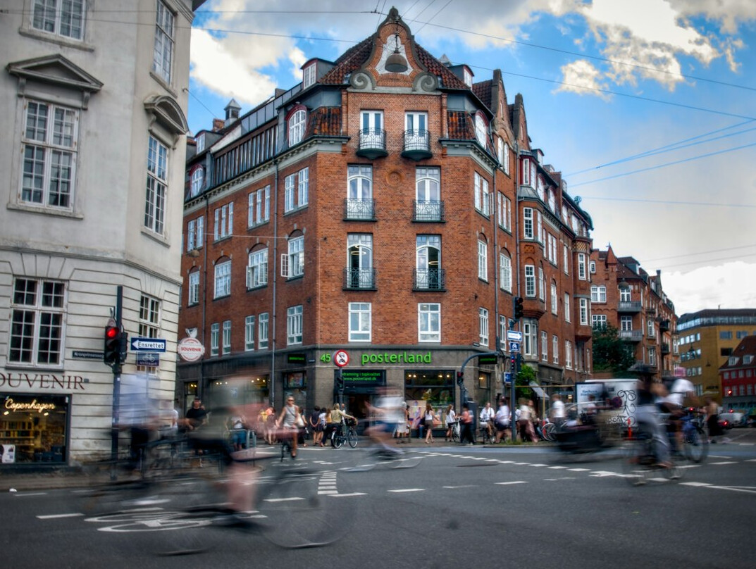 Cyclists riding through a Danish city street